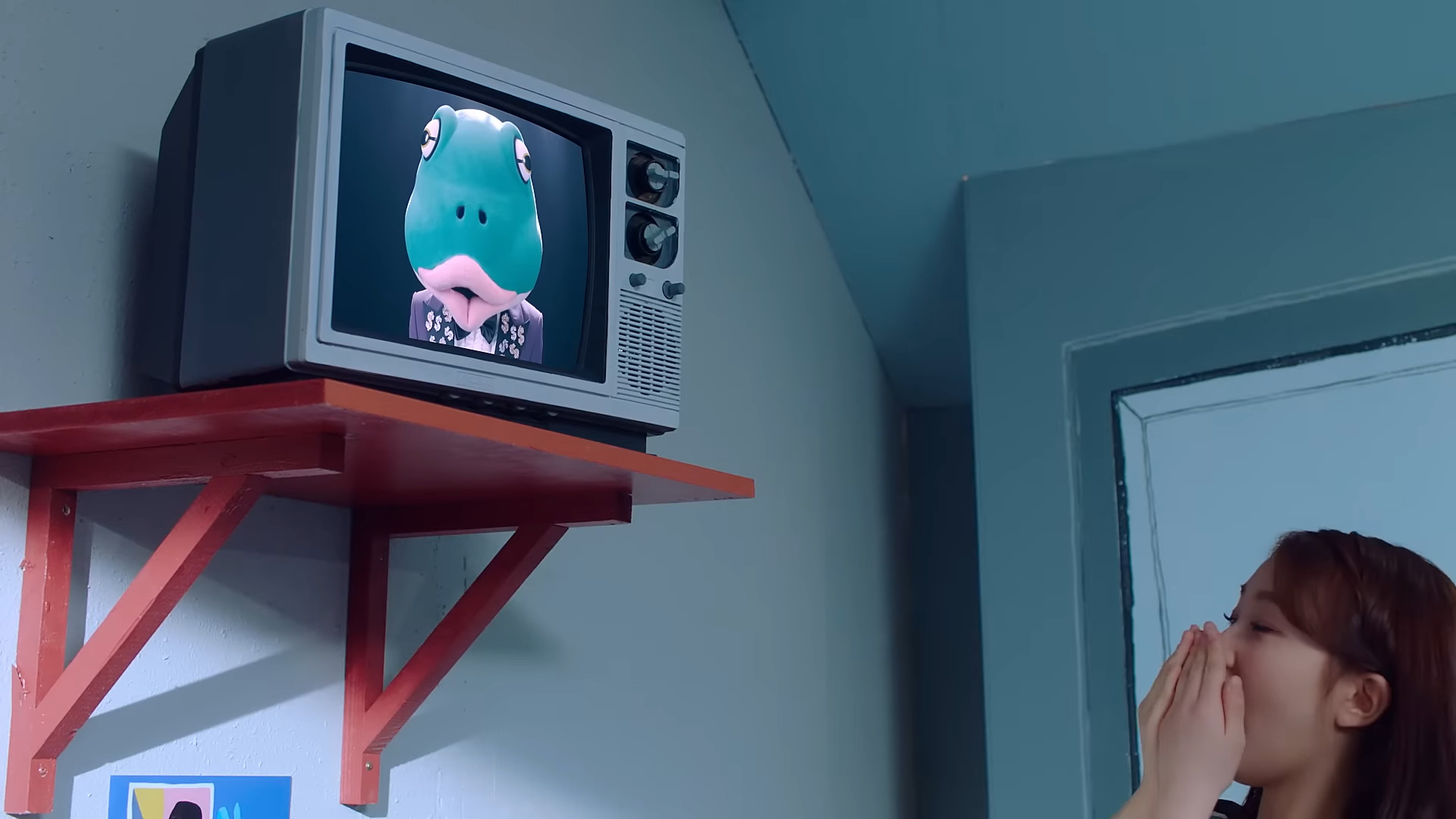 The frog's face on a TV screen.
